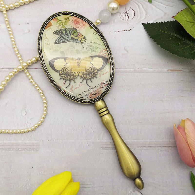 European Style Retro Bronze Makeup Mirror with Metal Handle Portable Hand-held Small Mirror Women Exquisite Oval Mirror