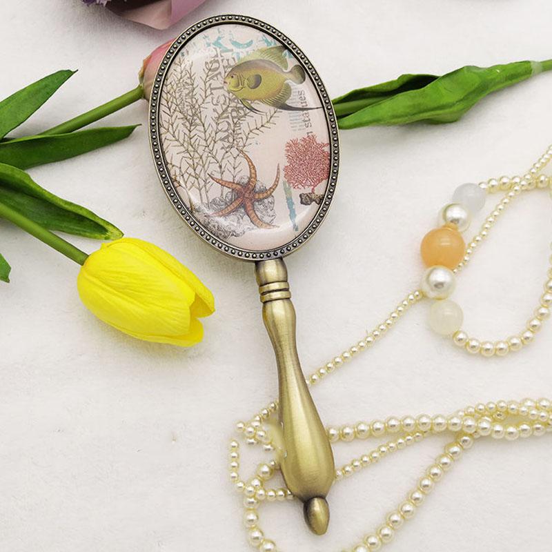 European Style Women Exquisite Oval Mirror Retro Bronze Makeup Mirror with Metal Handle Portable Hand-held Small Mirror